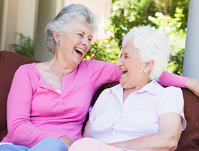 Stock photo - two women sitting outside.