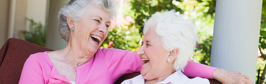 Stock photo - two women sitting outside.