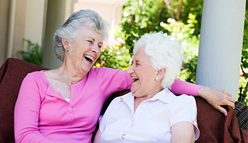 Stock photo - two women sitting outside.